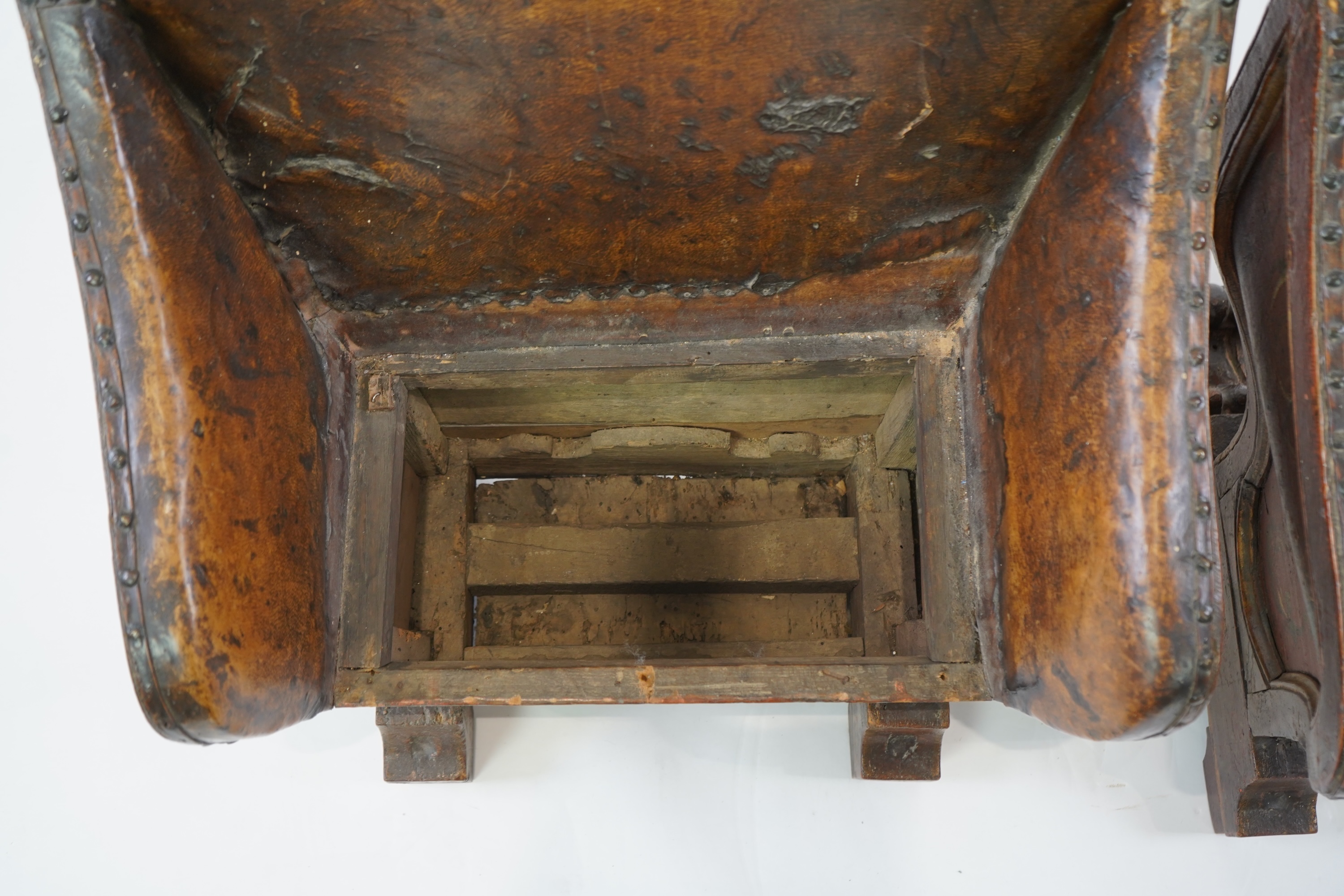 A pair of 19th century Venetian carved wood and tan leather Gondola seats